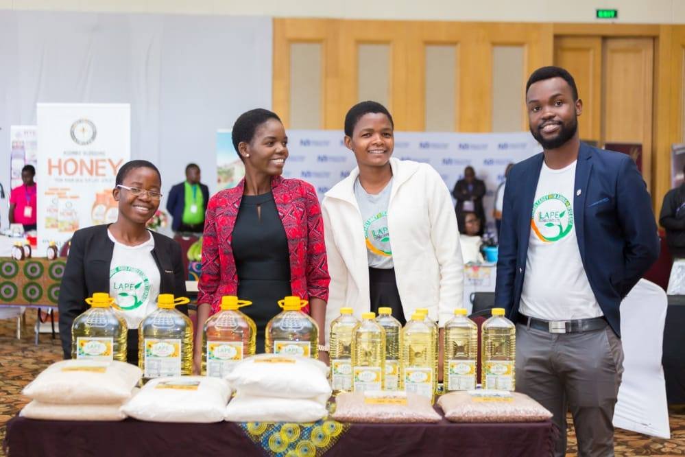 LAPE team showcasing premium cooking oil products